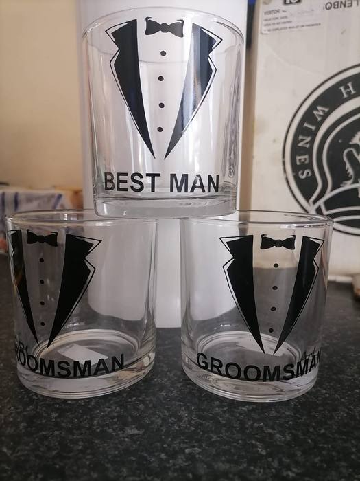 Three tumblers printed with tuxedo and bow tie designs, labelled Best Man and Groomsman