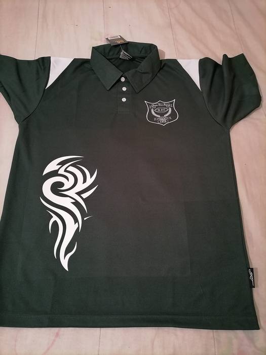 Dark green rugby club polo shirt with the club crest and a large white tribal flame print