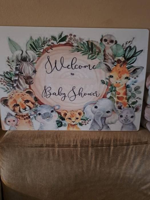 Baby shower welcome board printed with watercolour safari animals around the wording