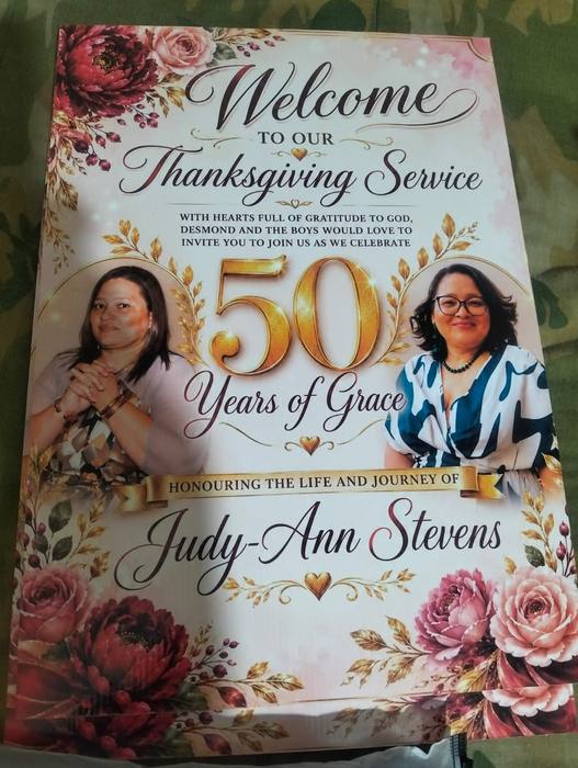 Full-colour welcome board for a fiftieth anniversary thanksgiving service, printed with photographs and a floral border